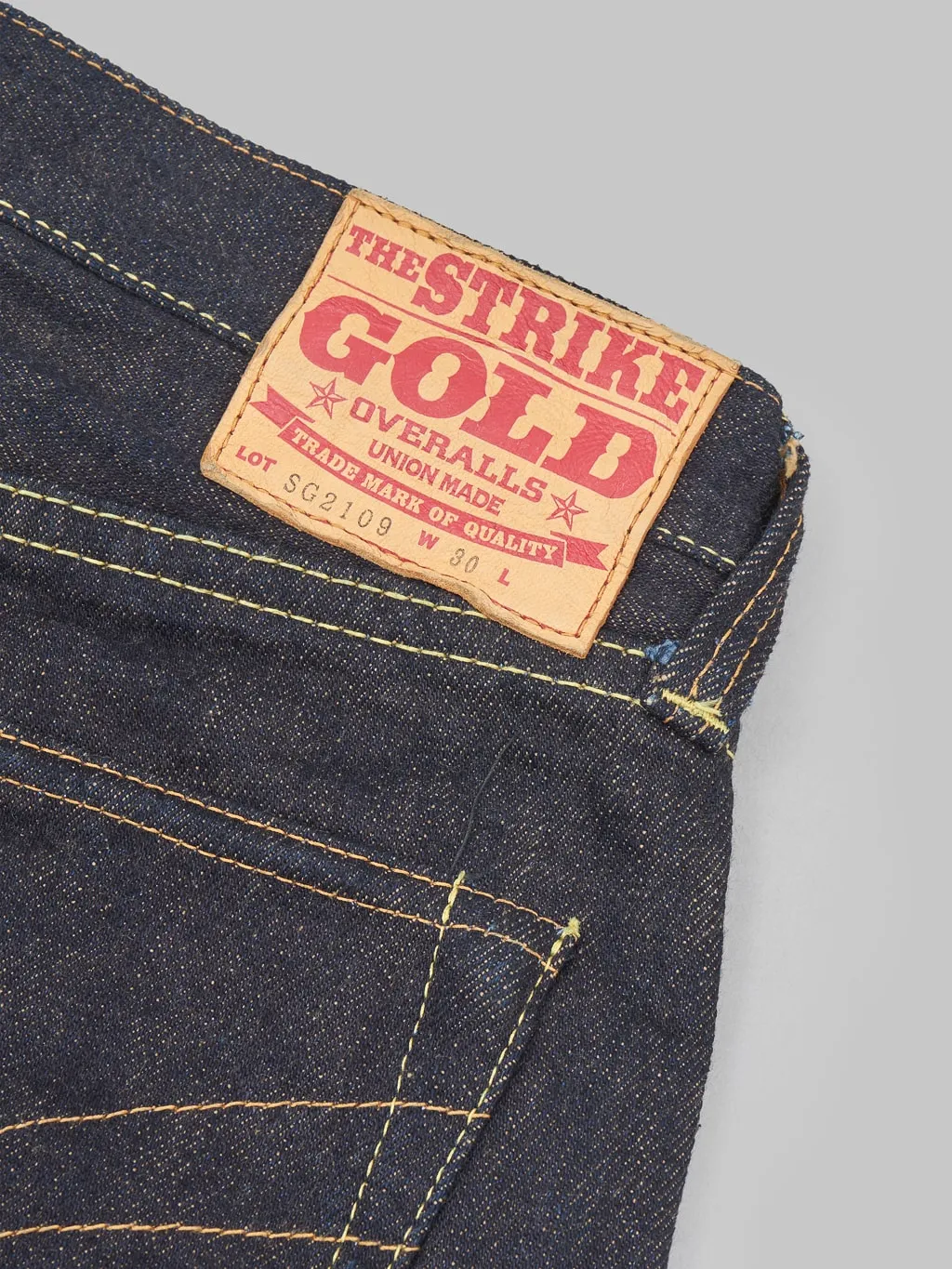 The Strike Gold 2109 Brown Weft Slim Tapered Jeans